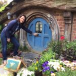 Hobbiton - like the Wairua Lodge itself, a magical place. Debbie opening the small Hobbit door.